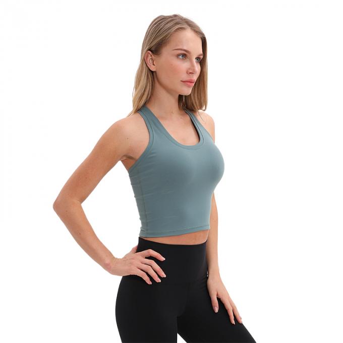O sutiã Wirefree dos esportes do Longline das mulheres por atacado acolchoou das mulheres feitas sob encomenda da camiseta de alças do apoio médio a camiseta de alças branca da colheita