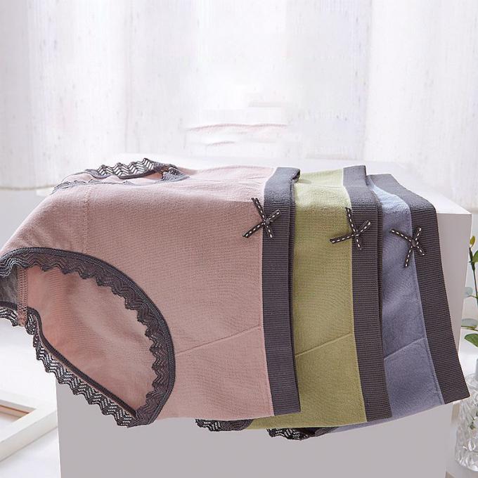A cuecas por atacado do roupa interior ata o calcinha do biquini para mulheres meados de sem emenda do roupa interior do algodão da cintura das mulheres
