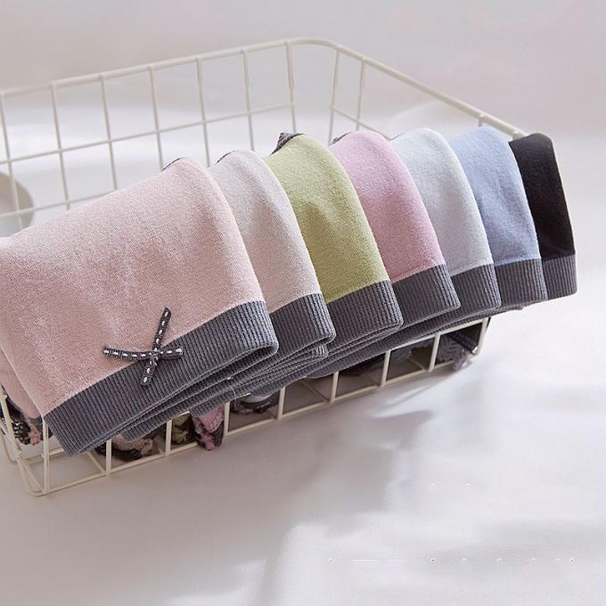 A cuecas por atacado do roupa interior ata o calcinha do biquini para mulheres meados de sem emenda do roupa interior do algodão da cintura das mulheres