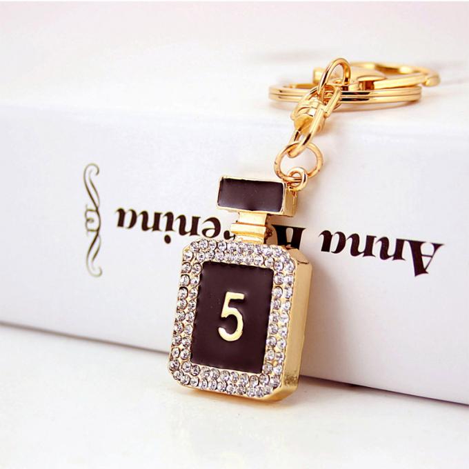 As senhoras Diamante-enchidas criativas perfumam o metal fêmea Crystal Keychain do cristal de rocha dos acessórios do saco da corrente chave de garrafa