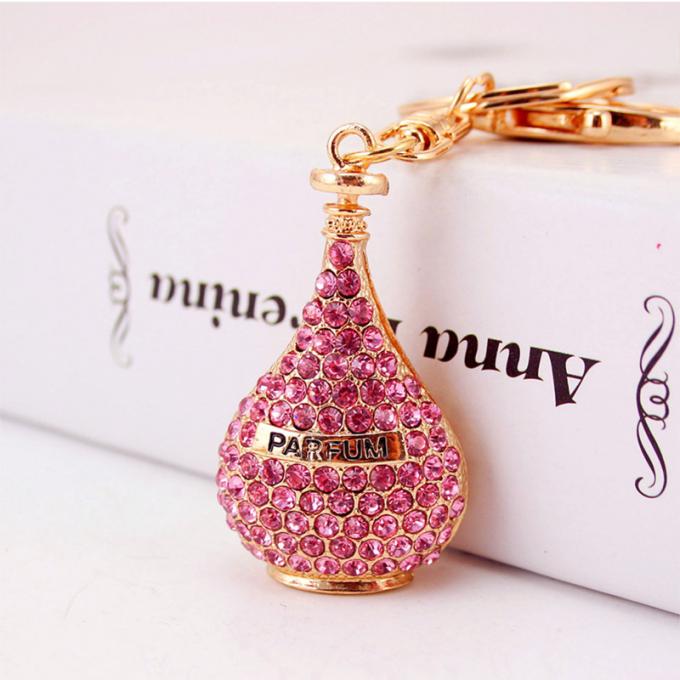 As senhoras Diamante-enchidas criativas perfumam o metal fêmea Crystal Keychain do cristal de rocha dos acessórios do saco da corrente chave de garrafa