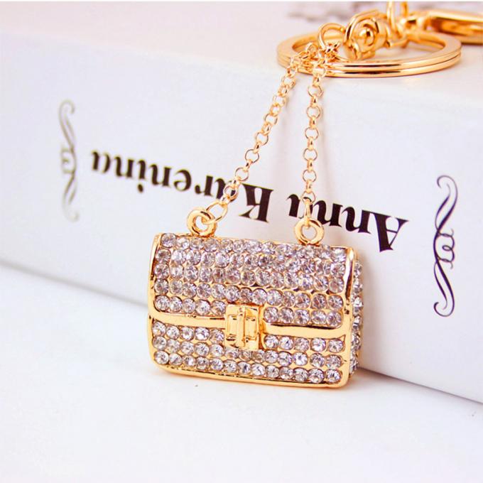 As senhoras Diamante-enchidas criativas perfumam o metal fêmea Crystal Keychain do cristal de rocha dos acessórios do saco da corrente chave de garrafa