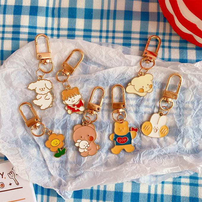 Desenhos animados bonitos Keychains dos acessórios pequenos por atacado dos ornamento do saco do pendente do metal da flor da corrente chave do coelho para mulheres
